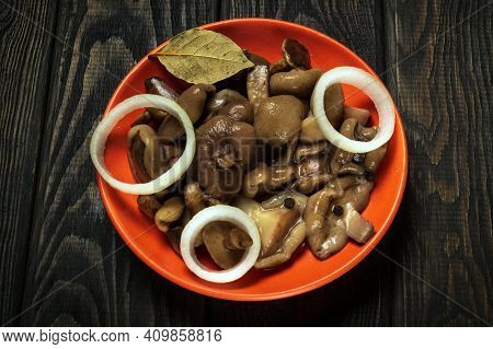 Suillus Luteus Or Boletus Luteus Mushrooms Marinated In A Plate With Spices And Onions On Vintage Ta