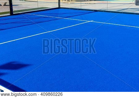 Bright Blue Tennis, Paddle Ball Or Pickleball Court View From Net To Service Boxes And Base Line Out