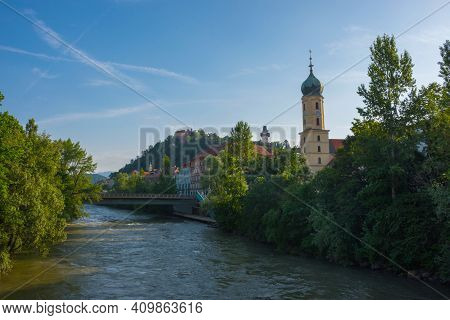 Mur River, The Franciscan Church Tower And The Famous Clock Tower (grazer Uhrturm) In The Background
