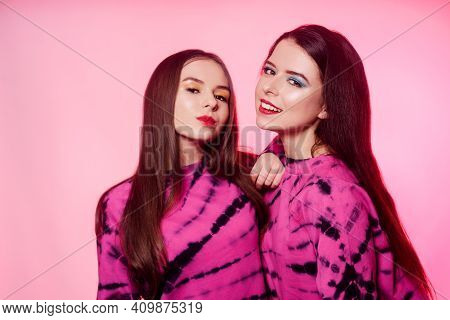2 Girls In The Same Things With Bright Makeup. Brunette Girls, Sisters, Girlfriends, Twins. Women's