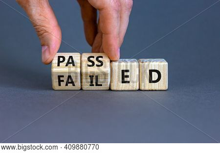 Passed Or Failed Symbol. Businessman Turns Wooden Cubes And Changes The Word 'failed' To 'passed' On