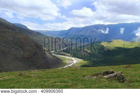A Distant Wide View Of The Valley Of The Dzhelo River On The Karagem Pass In Altai In Summer, In The