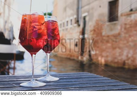 Two Glasses Of Spritz Veneziano Cocktail Served Near The Venetian Canal.