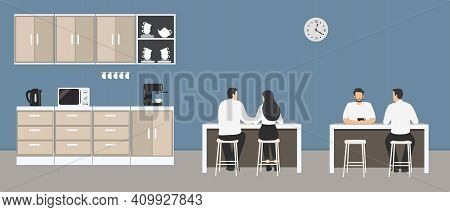 Office Kitchen. Dining Room In The Office. Employees Are Sitting At The Table. Coffee Break. There A