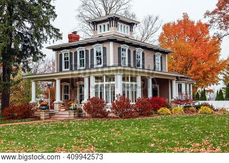 Vintage Italianate style house during autumn, architectural style popular in the 1800s 