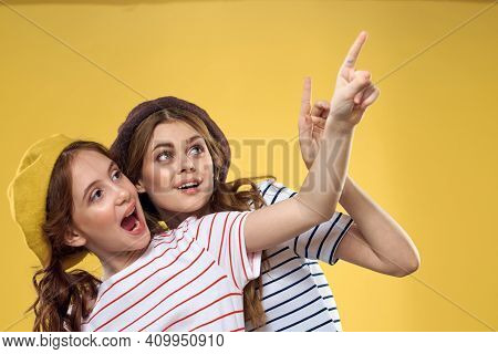 Mom And Daughter Embrace Joy Fun Childhood Lifestyle Yellow Background