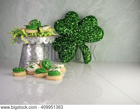 St Patrick's Day Holiday Frosted Sugar Cookies With Green And White Frosting And Sprinkles With Four