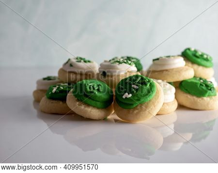 St Patrick's Day Holiday Frosted Sugar Cookies With Green And White Frosting And Sprinkles With Four