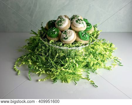 St Patrick's Day Holiday Frosted Sugar Cookies With Green And White Frosting And Sprinkles With Four