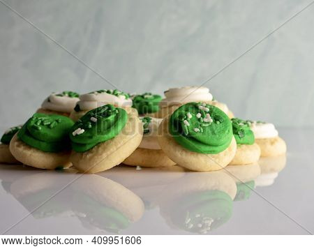 St Patrick's Day Holiday Frosted Sugar Cookies With Green And White Frosting And Sprinkles With Four