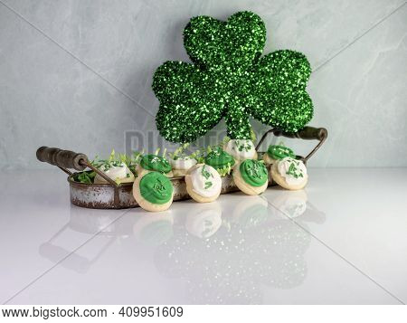 St Patrick's Day Holiday Frosted Sugar Cookies With Green And White Frosting And Sprinkles With Four