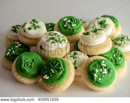 St Patrick's Day Holiday Frosted Sugar Cookies With Green And White Frosting And Sprinkles With Four