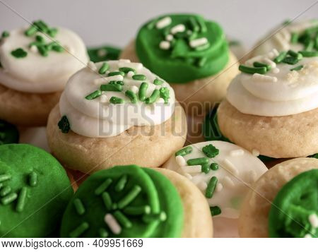 St Patrick's Day Holiday Frosted Sugar Cookies With Green And White Frosting And Sprinkles With Four