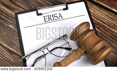 Paper With Erisa Employsee Retirement Income Security Act With Gavel, Pen And Glasses On The Wooden 