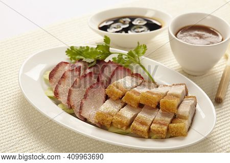 Oriental Roast Pork Belly Or Char Siew With Gravy And Side Dish Sauce In White Plate On White Backgr