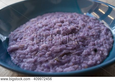 Homemade Risotto With Redcabbage In A Colored Dish