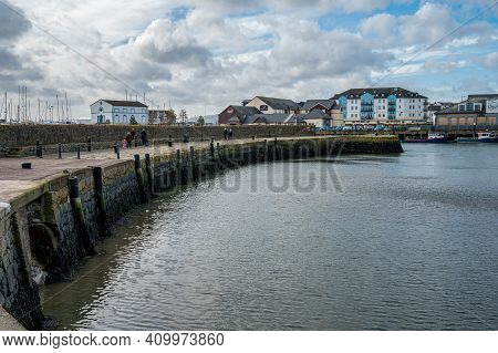 Carrickfergus, Northern Ireland- Feb 21, 2021: The Old Harbor In Carrickfergus.