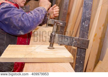 Process Of Drying Glue In The Manual Production Of Wooden Profiles In Carpentry. Clamp Tool For Fixi