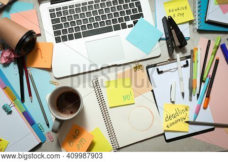 Messy Table With Laptop And Coffee, Flat Lay. Concept Of Being Overwhelmed By Work