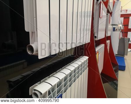 A Bimetallic Heating Radiator Of Eight Sections Is Sold In The Window Of A Specialized Store Selling