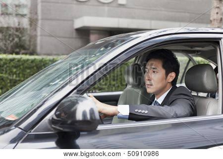 Businessman Driving Car