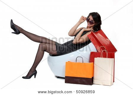 woman sitting next to bags