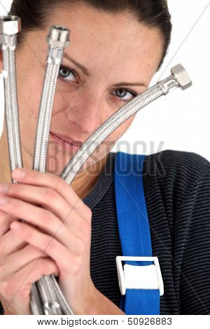 Female plumber with metal flexi pipes