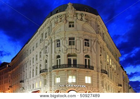 VIENNA, AUSTRIA - AUGUST 2012 : Cafe Griensteidl, famous coffee house and meeting point in Michaelerplatz square, Vienna, Austria at night on August 8, 2012. 