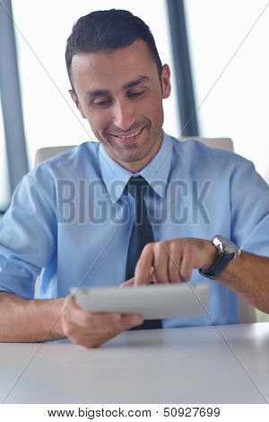 close-up of human hand  business man using tablet compuer at office