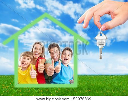 Happy family near new home. Real estate background.