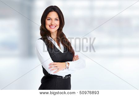 Young beautiful business woman. Over blue background.