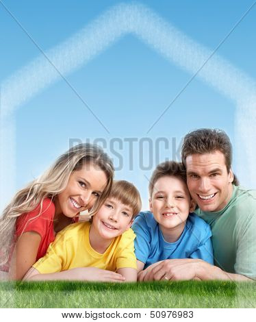 Happy family near new home. Real estate background.
