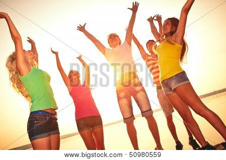 Group of young people at the beach of sea