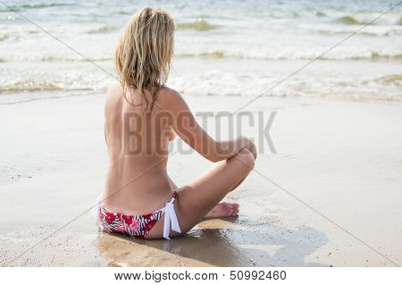 Young pretty topless girl