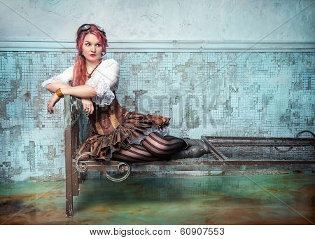 Beautiful Steampunk Woman On The Metal Bed