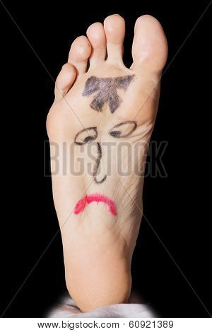 Painted Sad Face On The Woman's Feet