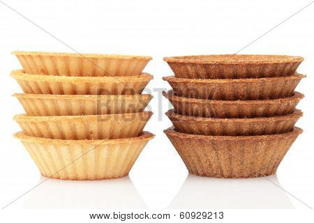 Stack Of Empty Light And Dark Tartlets