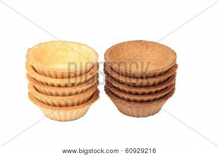 Stack Of Empty Light And Dark Tartlets