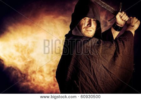 Portrait of a courageous warrior wanderer in a black cloak and sword in hand. Historical fantasy.