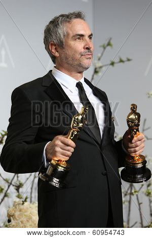 LOS ANGELES - MAR 2:: Alfonso Cuaron  in the press room at the 86th Annual Academy Awards on March 2, 2014 in Los Angeles, California