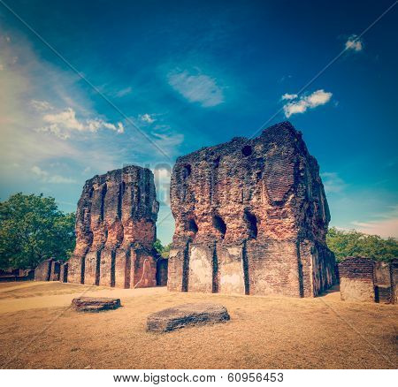 Vintage retro hipster style travel image of ancient Royal Palace ruins - UNESCO World Heritage Site. Pollonaruwa, Sri Lanka