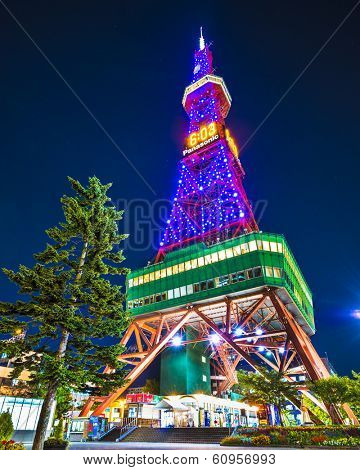 SAPPORO, JAPAN - OCTOBER 16, 2012: Sapporo Tower stands over Odori Park. The 147.2 meter high tower has an observation deck open to tourists.