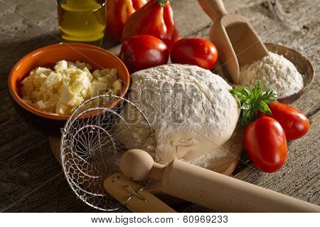 dough and ingredients for homemade pizza