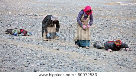 Mt Kailash, Tibet, China - May 26, 2012: Buddhist pilgrim making the kora (circumambulation) around Mt. Kailash and performing full body prostrations