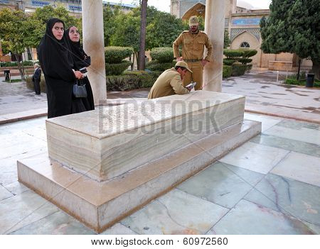 SHIRAZ, IRAN ÃÂ¢Ã?Ã? NOVEMBER 26, 2007 ÃÂ¢Ã?Ã? Iranian military servicemen with their wives visiting the Tomb of Persian poet Hafez in Shiraz. Hafez is supposed to be one of the most famous poets in Iran