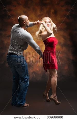 Young couple dances Caribbean Salsa