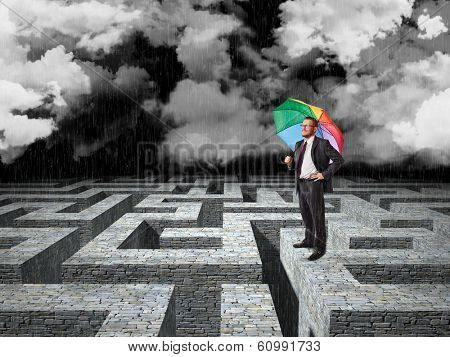 man with umbrella and 3d maze background