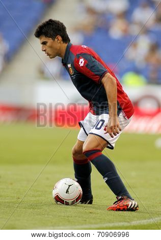 BARCELONA - AUG, 17: Diego Perotti of Genoa CFC in action during a friendly match against RCD Espanyol at the Estadi Cornella on August 17, 2014 in Barcelona, Spain