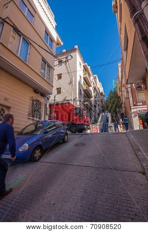 Barcelona, Spain - Feb 7, 2014: Baixada De La Gloria Street Leading To Famous Park Guell Entrance On
