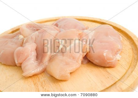 อย่างใกล้ชิดของเนื้อไก่บน Hardboard แยกต่างหาก